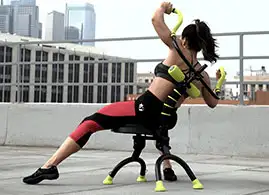 Woman flexing her back to the right on the Ab Doer 360