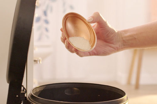 dumping foot filings into trash can
