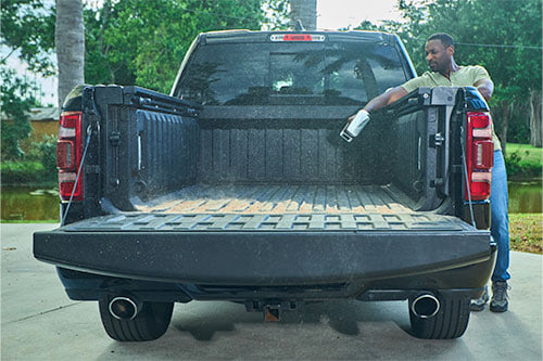 man cleaning truck bed