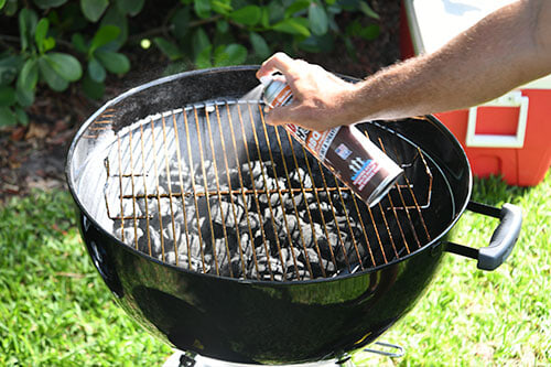 spraying charcoal grill