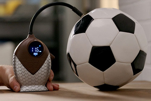 inflating soccer ball