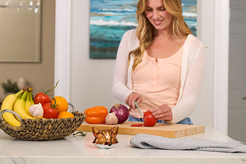 woman cutting veggies