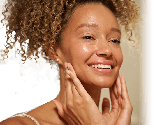 woman applying face serum