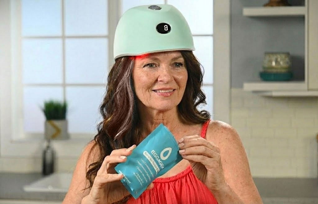 woman with robins egg on head