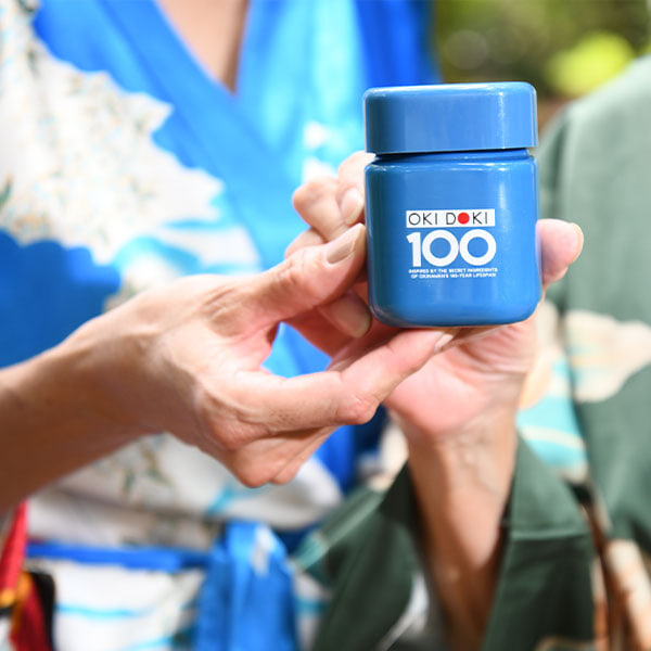 holding a jar of oki doki