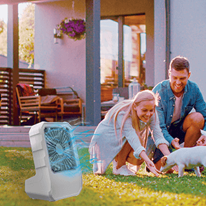 Arctic Air&reg; Outdoor cooling off a family in the backyard