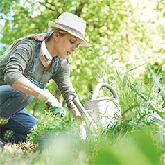 Youg woman outside gardening
