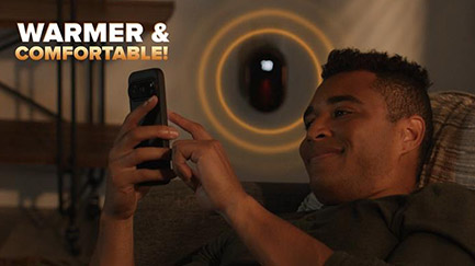 Man sitting comfortable with Handy Heater® Copper Core