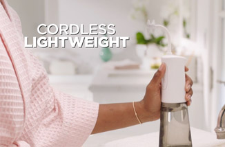 Woman using Miracle Smile&reg; in the shower