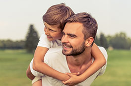Father and son playing in the park