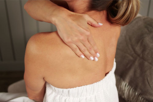woman rubbing back
