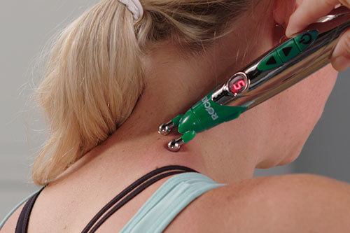 Woman using Hempvana Rocket on back of neck